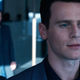 Agent Smith looking out a window.